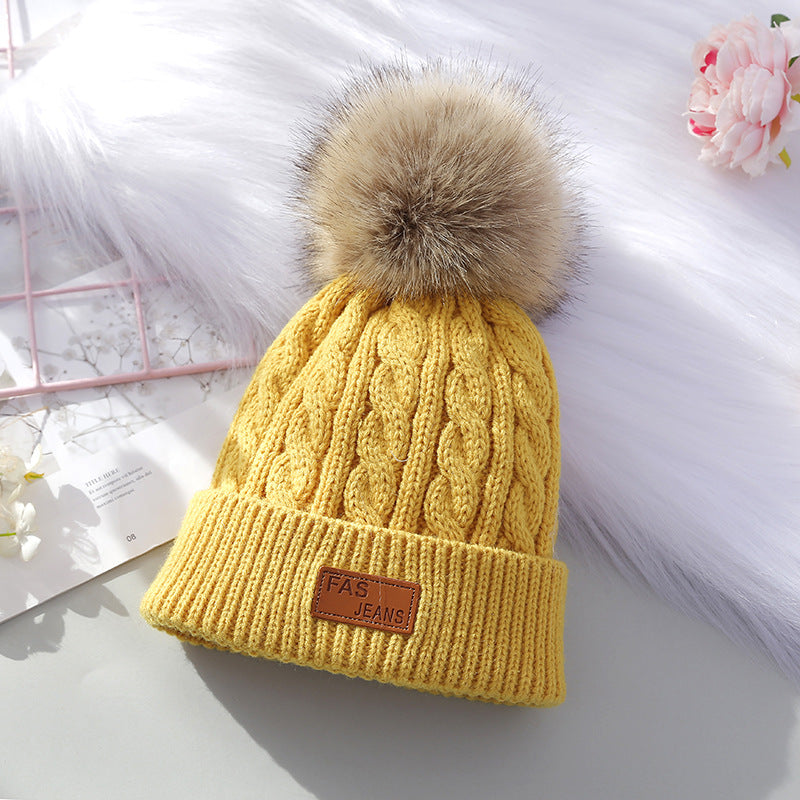 Cute children's knitted hat in red color