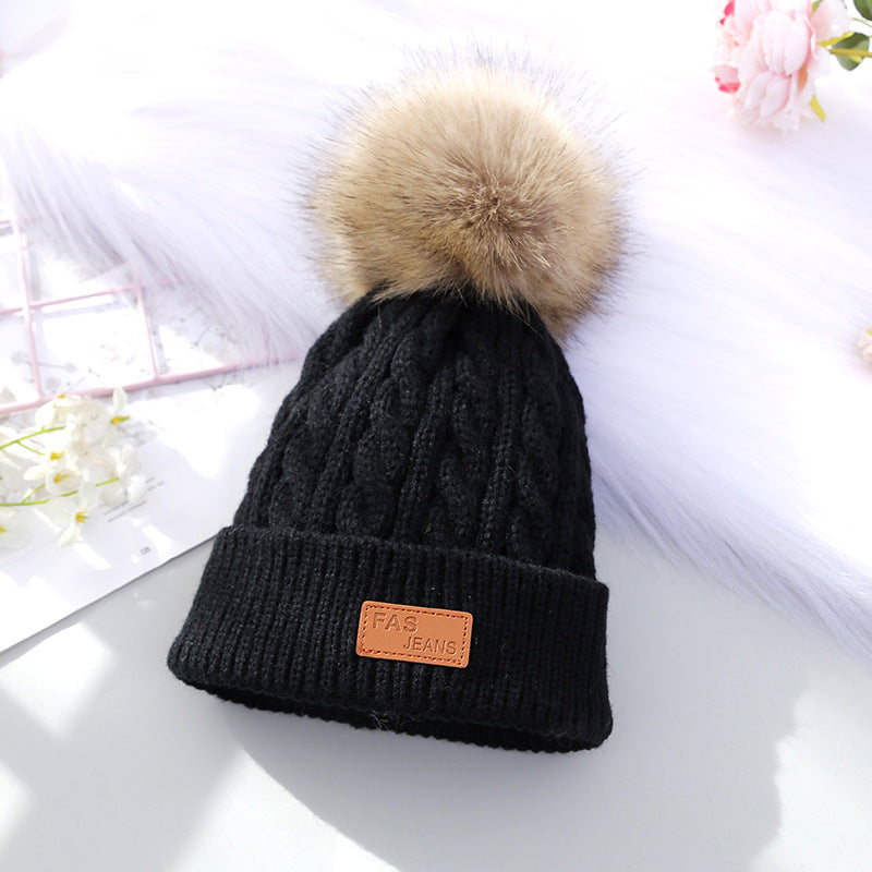 Stylish black knitted beanie for children