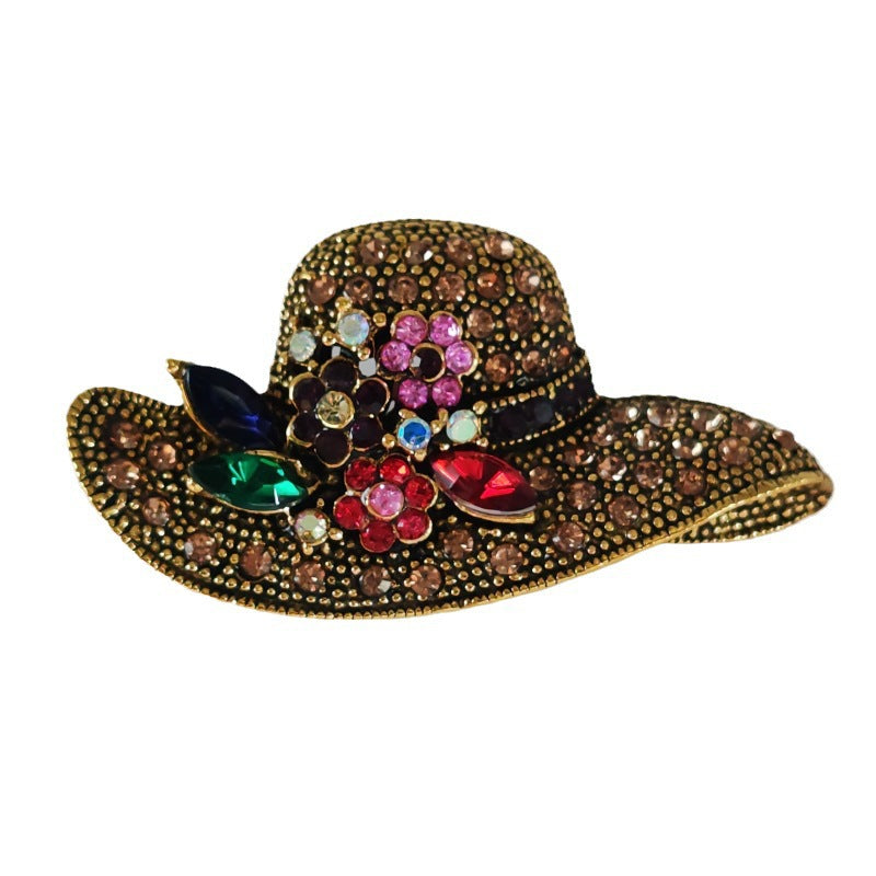 Gold alloy brooch with rhinestones - image 1