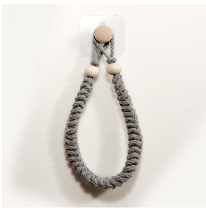 Handwoven rope toilet paper holder front view