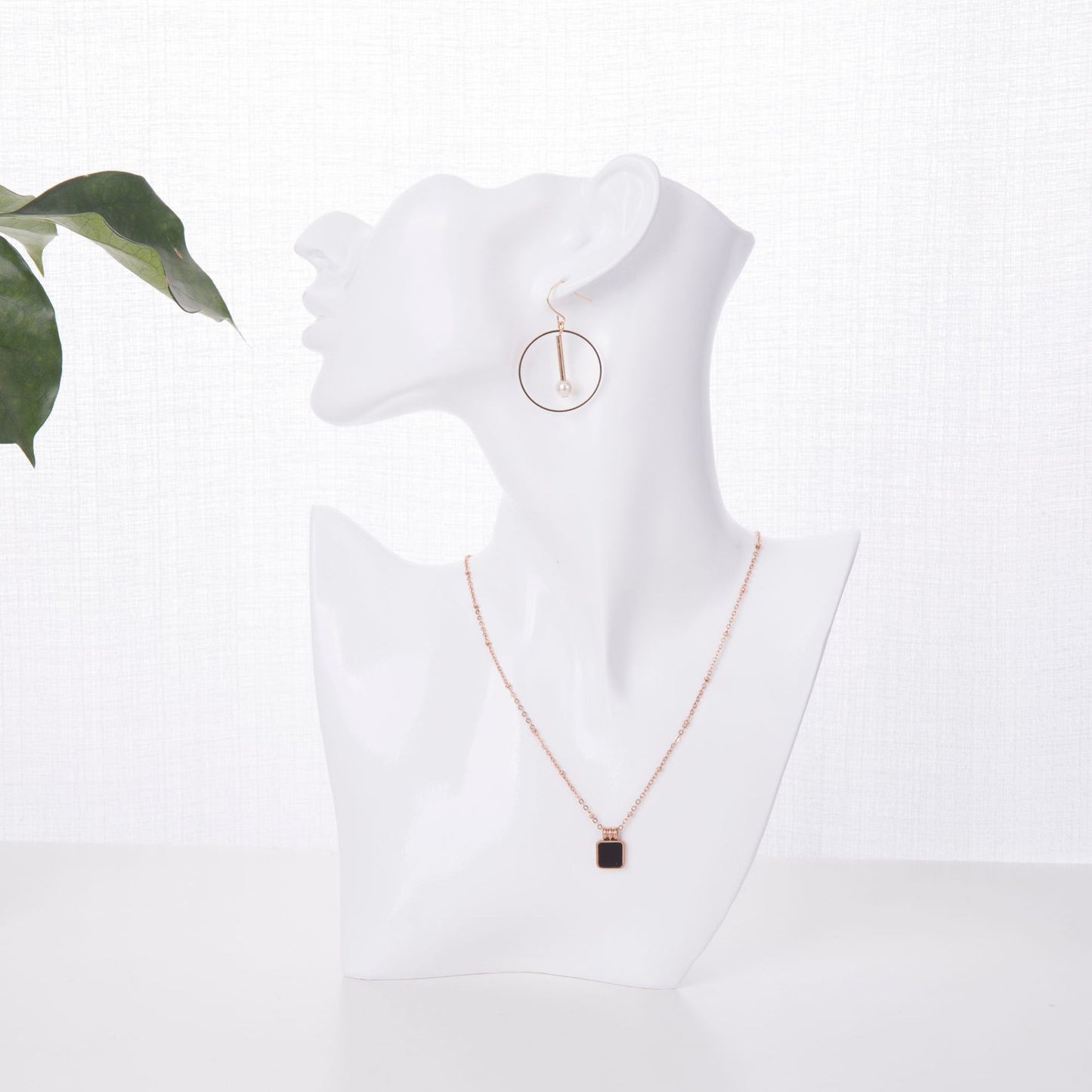 sophisticated white mannequin jewelry stand