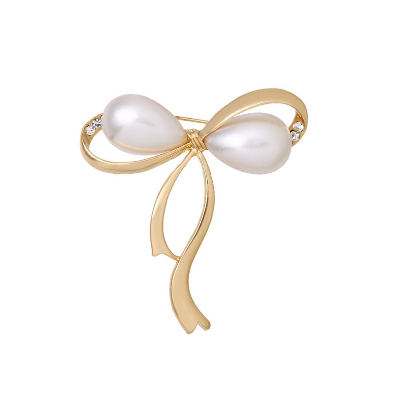 Elegant Pearl Bow Brooch with Rhinestones - Image 1
