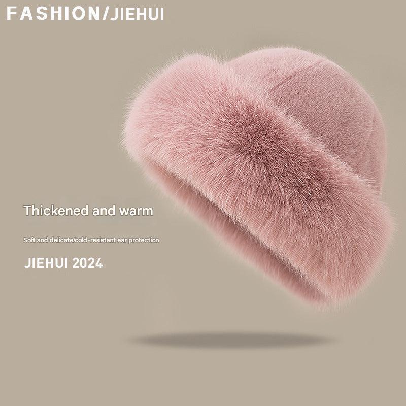 Pink knitted winter hat for women close-up