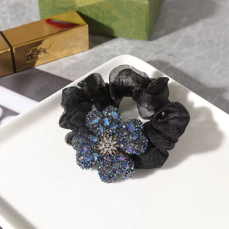 Chic fabric hair tie in clover pattern - champagne color