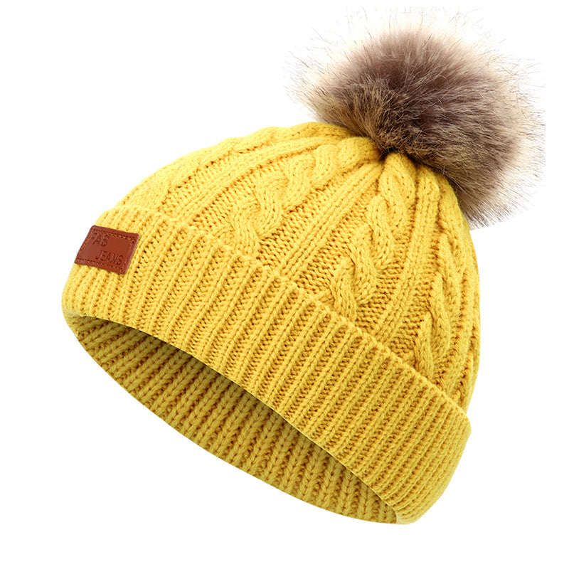 Colorful pom-pom knit hat for children