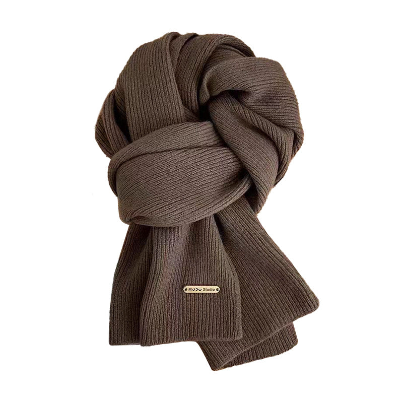 Warm knitted scarf beige color