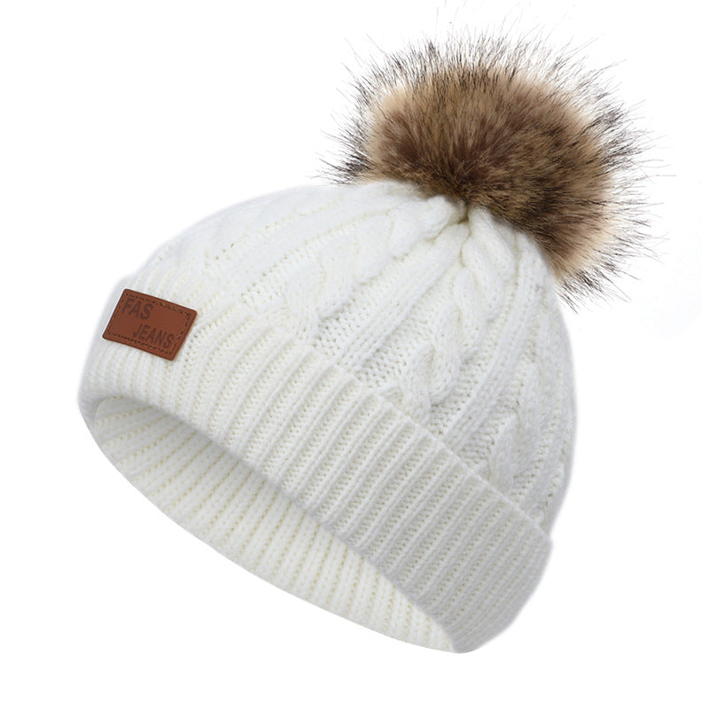 Colorful pom-pom knit hat for children