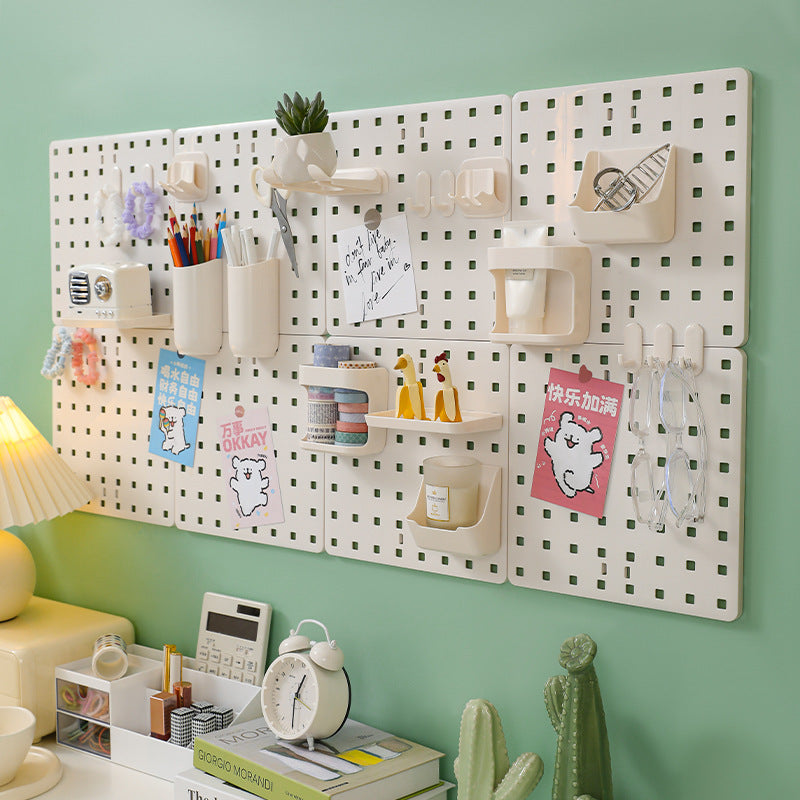 Image of wall-mounted pegboard organizer with various compartments