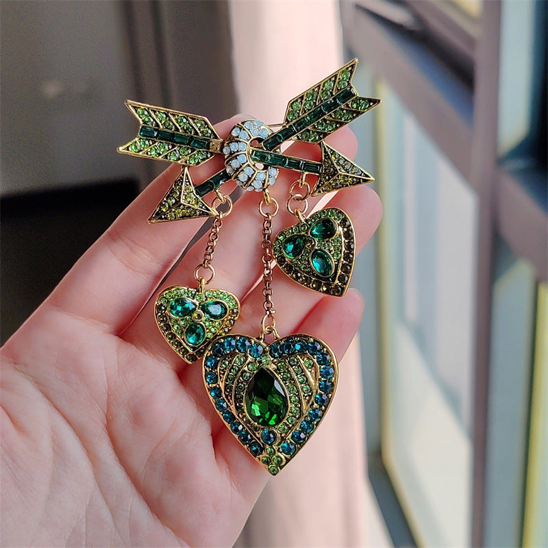 Vintage Cupid heart arrow brooch in pink with tassels