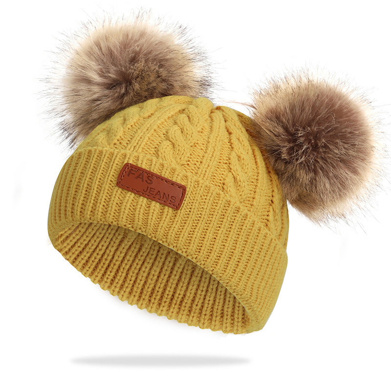 Colorful pom-pom knit hat for children