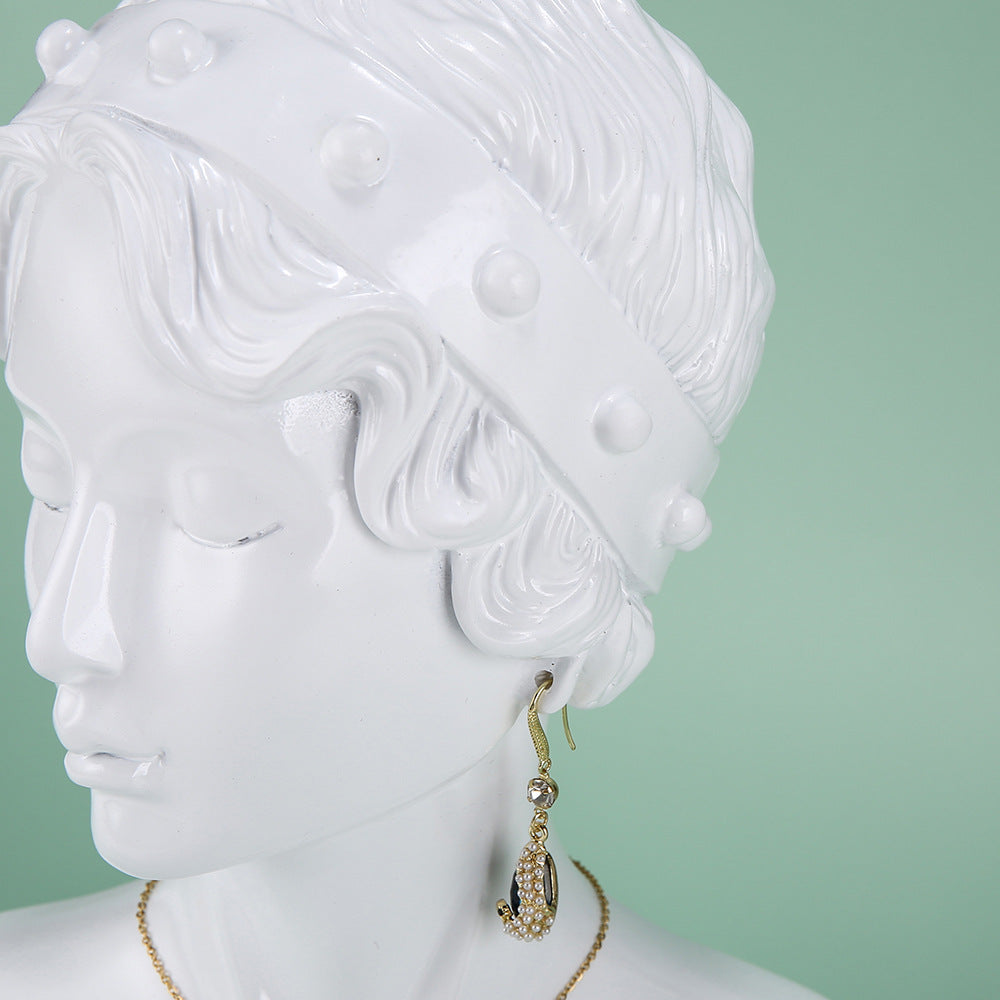 resin mannequin jewelry stand black profile view