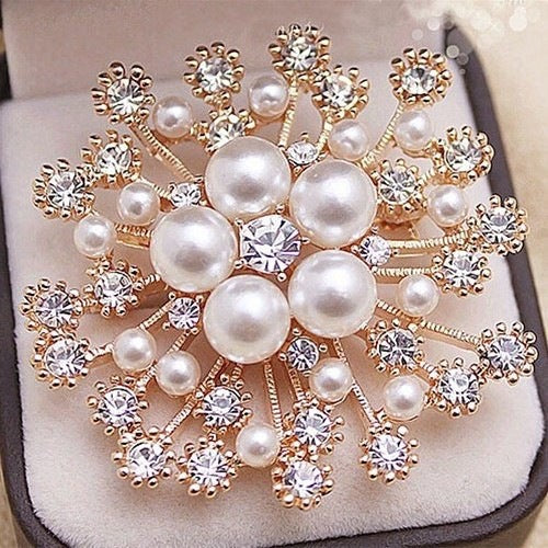 Rhinestone embellished brooch on a dress image 5
