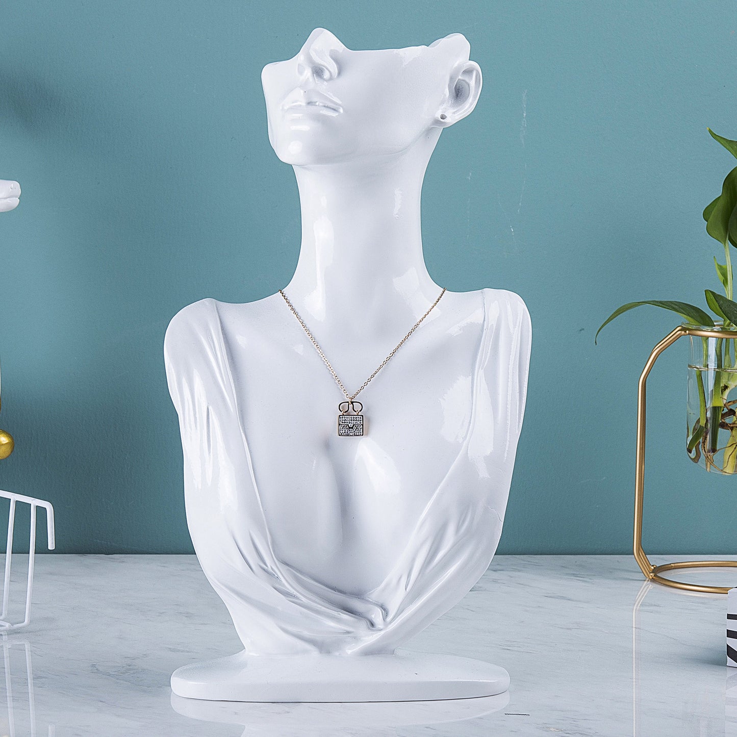 resin jewelry display stand in white storefront