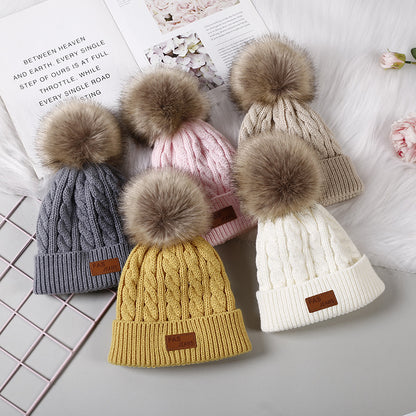 Kids pom-pom winter hat in dark blue