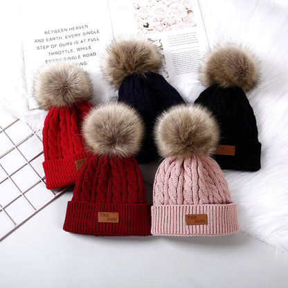 Cute children's knitted hat in red color