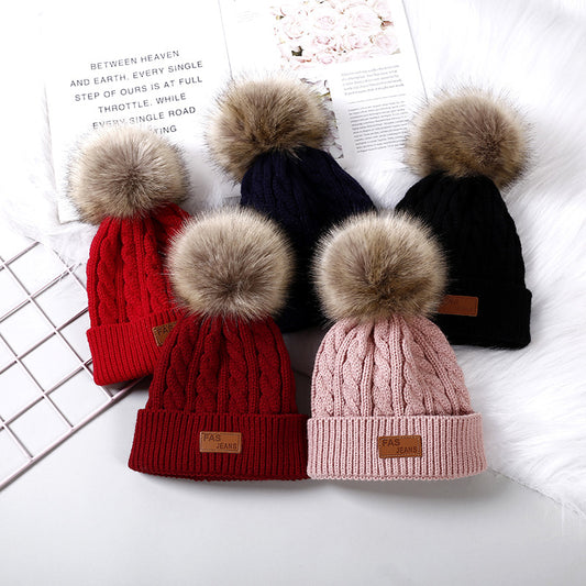 Cute children's knitted hat in red color