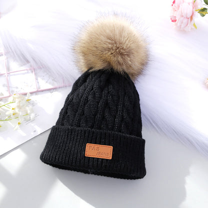 Stylish black knitted beanie for children