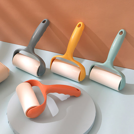 demonstration of using lint roller on fabric surface