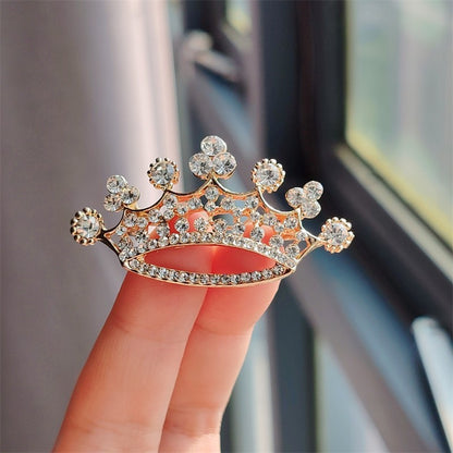 Detailed close-up of rhinestone crown pin
