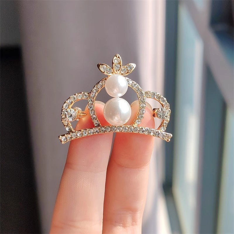 Couple's matching crown brooches