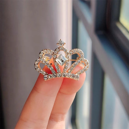 Detailed close-up of rhinestone crown pin