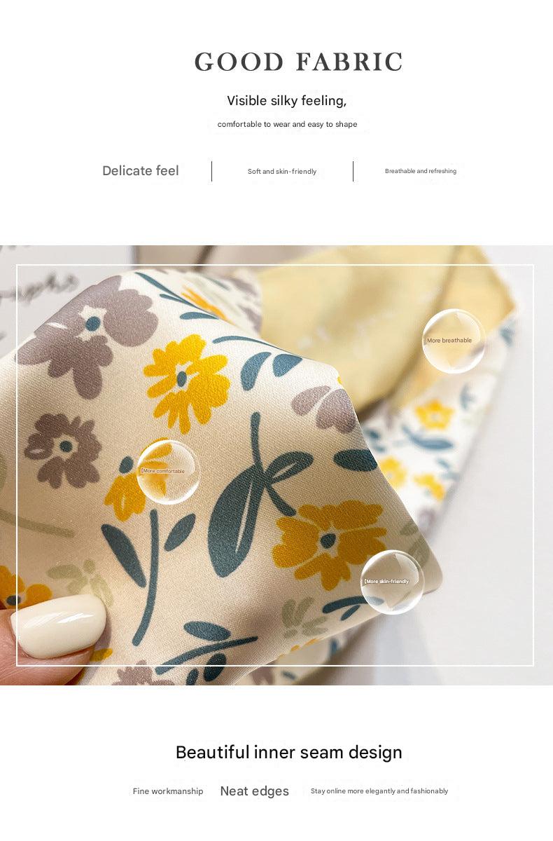 Yellow scarf displaying floral designs