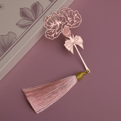 Elegant metal bookmark displayed on an open book
