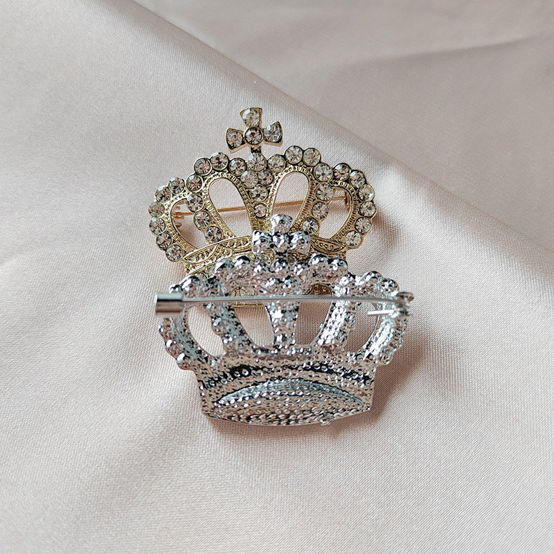 Detailed close-up of rhinestone crown pin