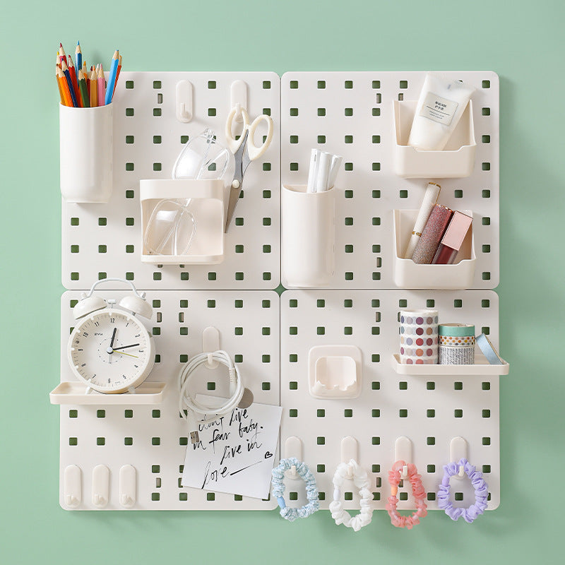 Dorm room setup with pegboard organizer
