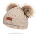Khaki hat with double pom-poms