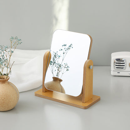 Compact wooden makeup mirror on desk