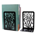 A pair of black bird bookends on a tree