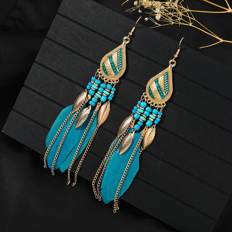 Stylish tassel earrings on model