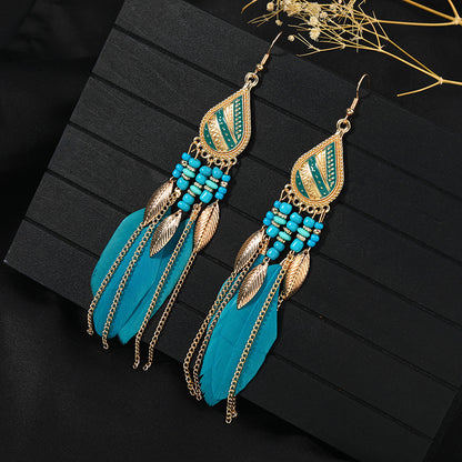 Stylish tassel earrings on model