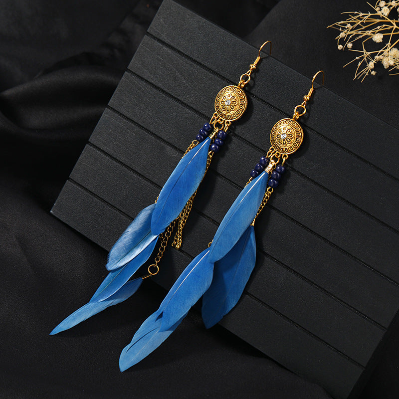 Stylish tassel earrings on model