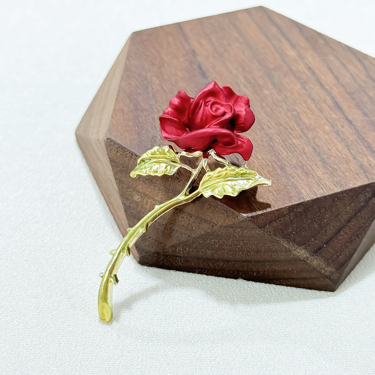 Red rose brooch worn on jacket image 3