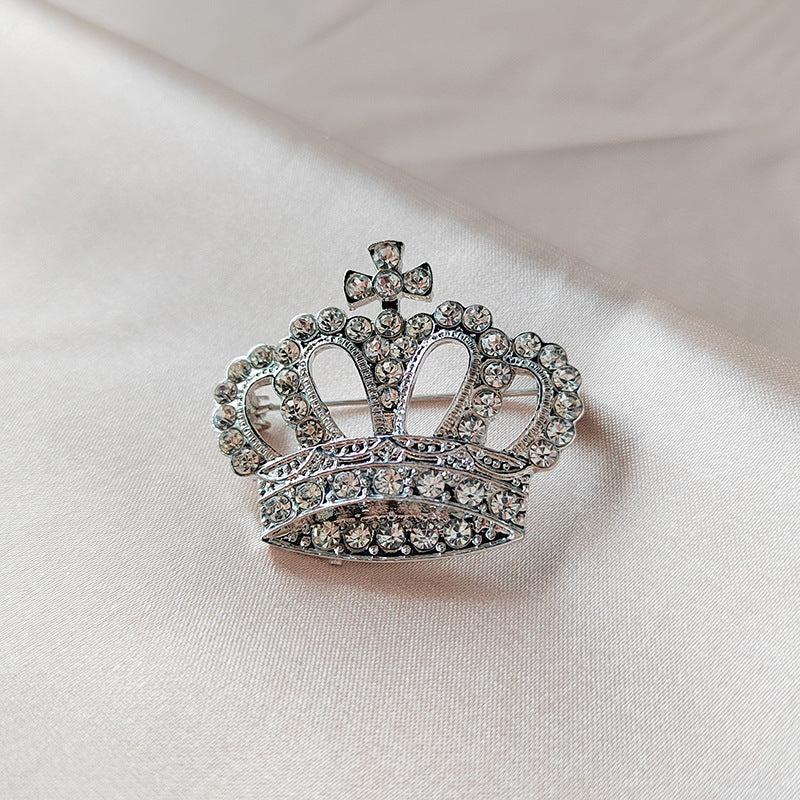 Silver crown brooch accessory