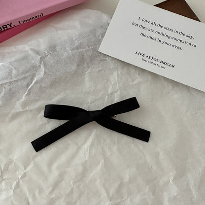 Charming bow hair clip in black