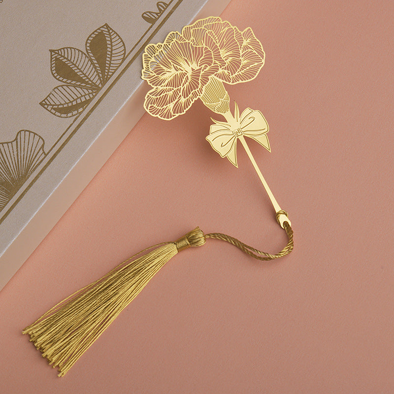 Elegant metal bookmark displayed on an open book