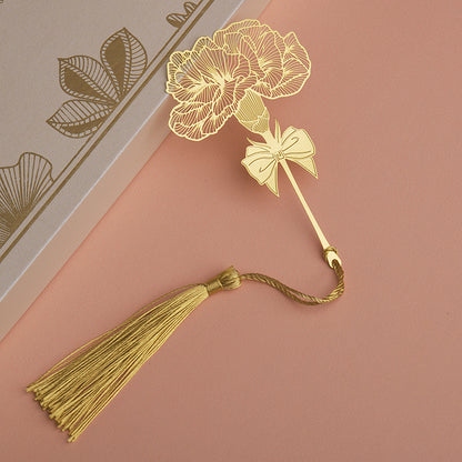 Elegant metal bookmark displayed on an open book