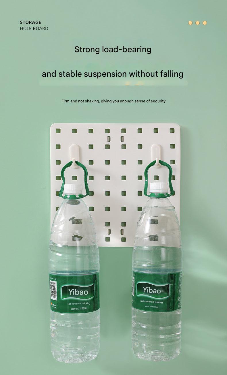 Image of wall-mounted pegboard organizer with various compartments