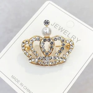 Detailed close-up of rhinestone crown pin