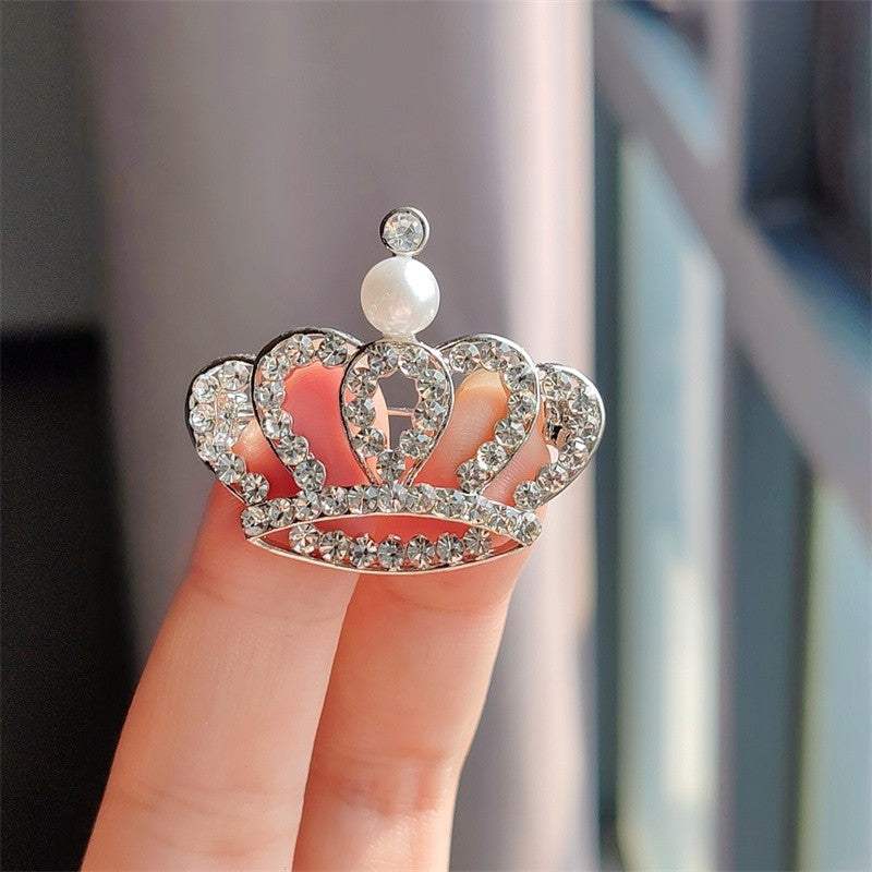 Couple's matching crown brooches