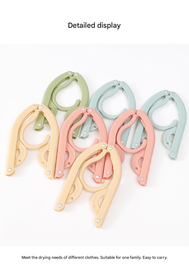 Compact travel folding clothes hanger image 1