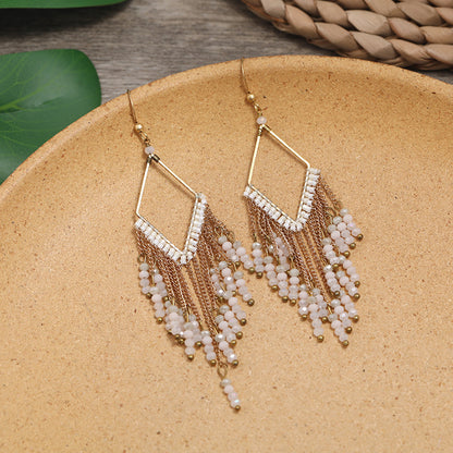 Colorful ethnic earrings displayed elegantly image 4