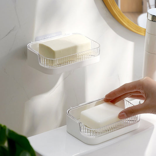Wall-mounted soap holder with suction cups in bathroom
