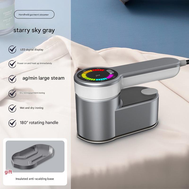Steam iron in use on fabric