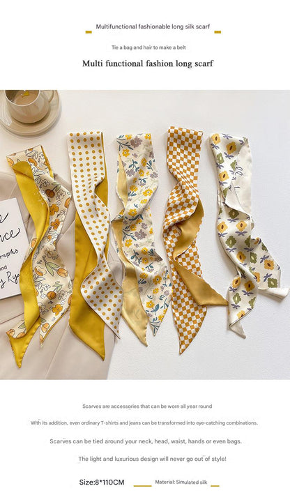 Yellow floral scarf tied to bag