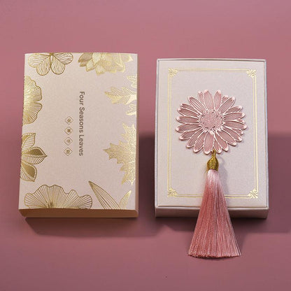 Elegant metal bookmark displayed on an open book
