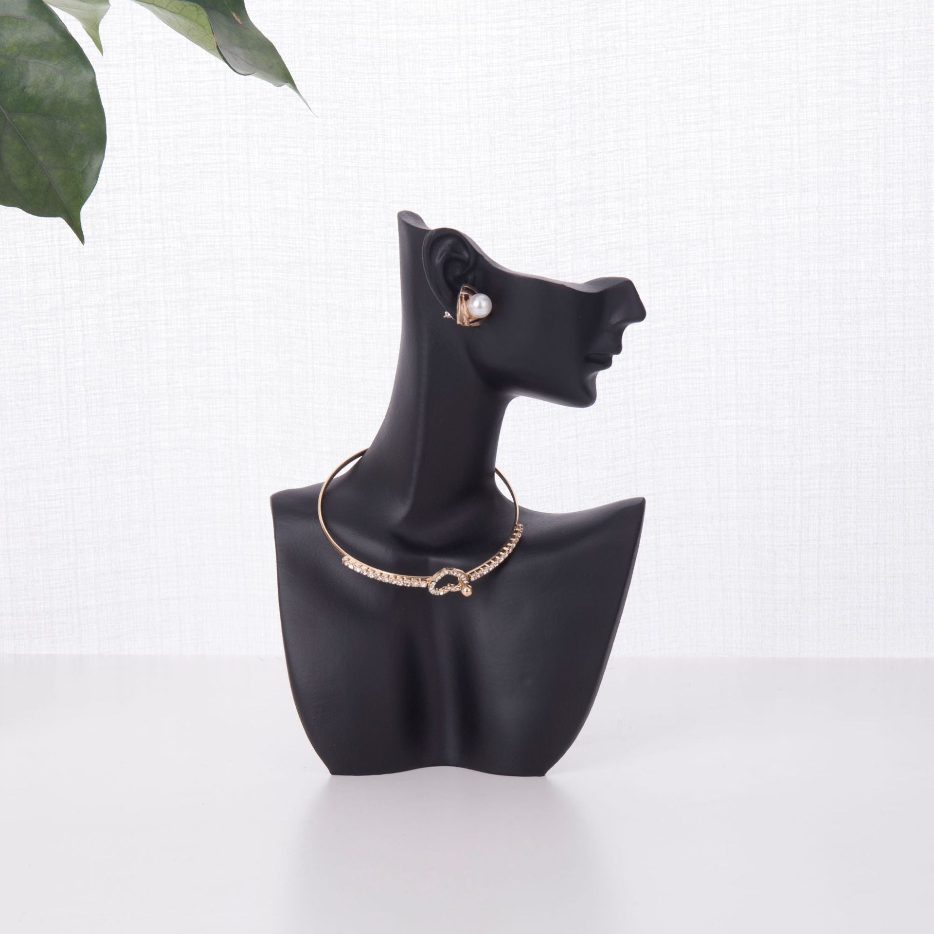 resin jewelry display stand in white storefront